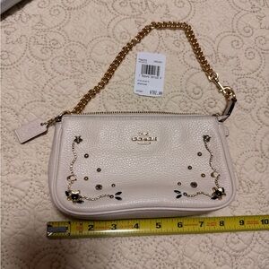 Coach Ivory Leather Wristlet with Gold Chain and Floral Studs